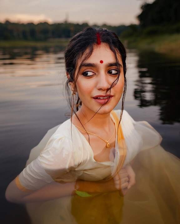 Priya Prakash Varrier hot saree image in a pond